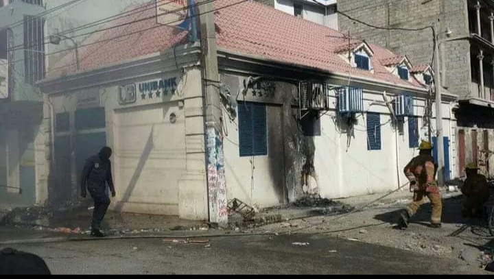  Cap Haitian a Unibank burned down by protesters.